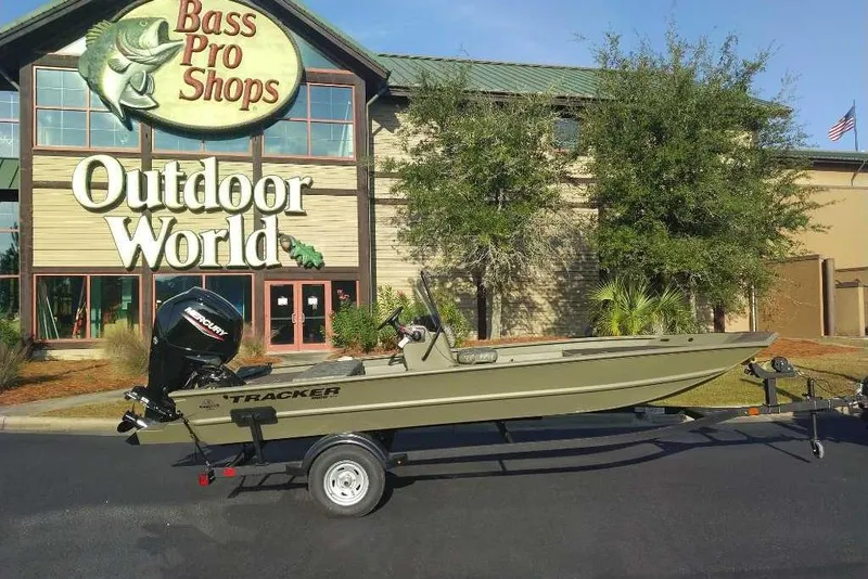 The Image of 2026 Tracker Grizzly 1860 CC boat on trailer outside Bass Pro Shops Outdoor World. - 0