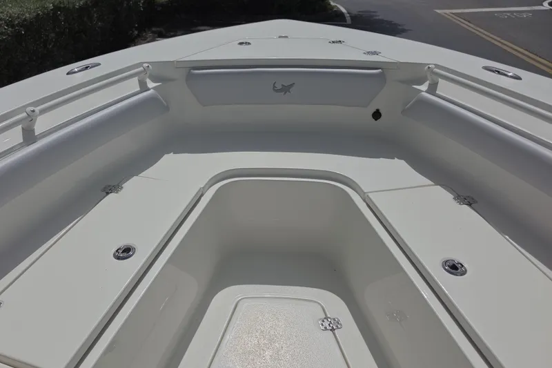 Slide: The Image of 2026 Mako 226 Center Console boat interior, featuring spacious seating and storage compartments. - 15