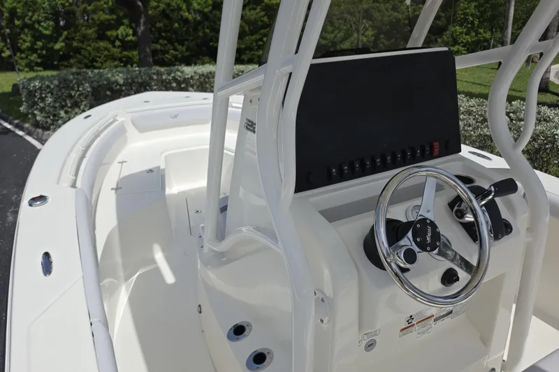 Slide: The Image of 2026 Mako 226 Center Console boat with sleek steering wheel and control panel. - 7