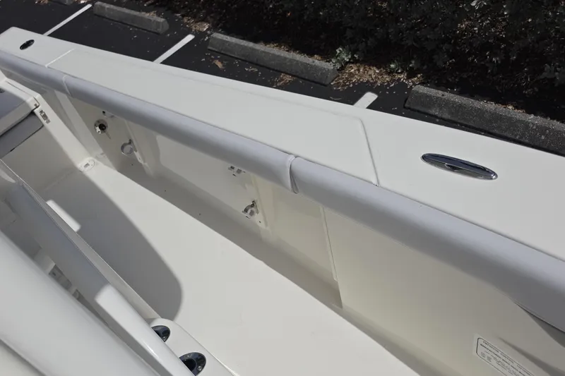 Slide: The Image of 2026 Mako 226 Center Console boat interior, featuring sleek white design and modern fittings. - 69