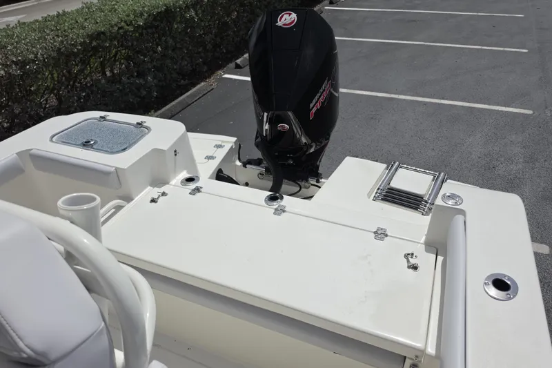 Slide: The Image of 2026 Mako 226 Center Console boat with outboard motor in parking lot. - 11