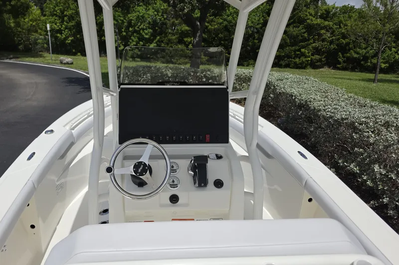Slide: The Image of 2026 Mako 226 Center Console boat interior with steering wheel and control panel. - 5