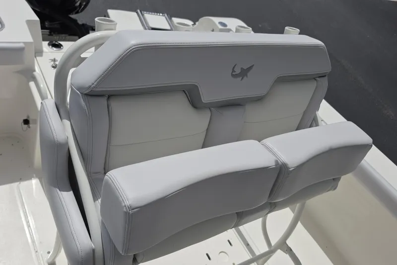 Slide: The Image of 2026 Mako 226 Center Console boat with sleek gray seating and shark logo. - 14
