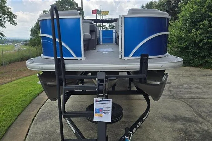 Slide: The Image of 2026 Sun Tracker Party Barge 22 XP3 pontoon boat on trailer, front view. - 5