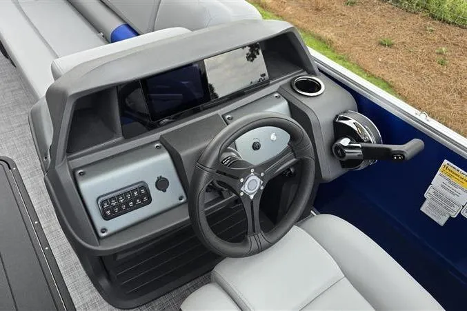 Slide: The Image of 2026 Sun Tracker Party Barge 22 XP3 helm with modern controls and comfortable seating. - 8