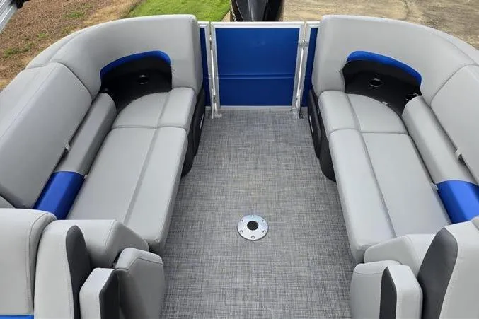 Slide: The Image of 2026 Sun Tracker Party Barge 22 XP3 interior with gray and blue seating, spacious layout. - 10