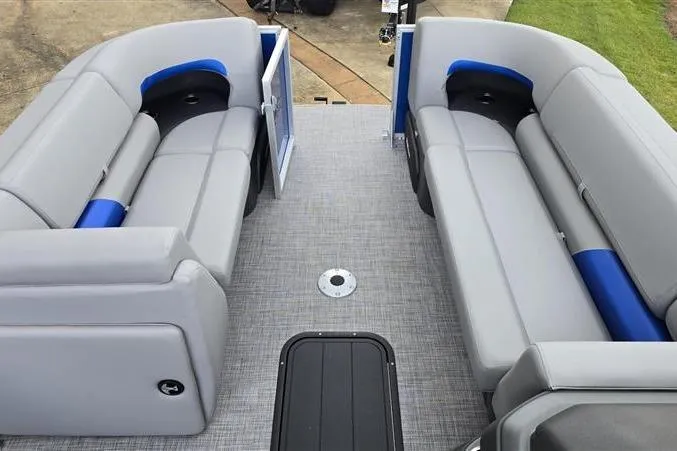 Slide: The Image of 2026 Sun Tracker Party Barge 22 XP3 interior with gray seating and blue accents. - 7