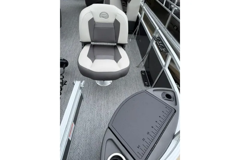 Slide: The Image of 2026 Sun Tracker Bass Buggy 18 DLX interior with cushioned seat and measuring board. - 11