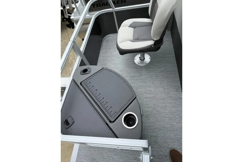 Slide: The Image of 2026 Sun Tracker Bass Buggy 18 DLX interior with swivel seat and measuring board. - 12