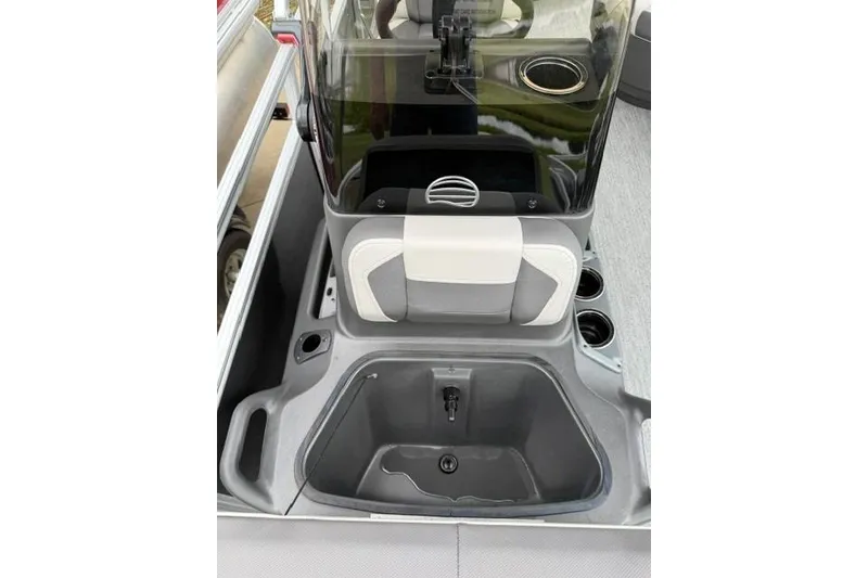 Slide: The Image of 2026 Sun Tracker Bass Buggy 18 DLX boat interior with console and storage compartment. - 7