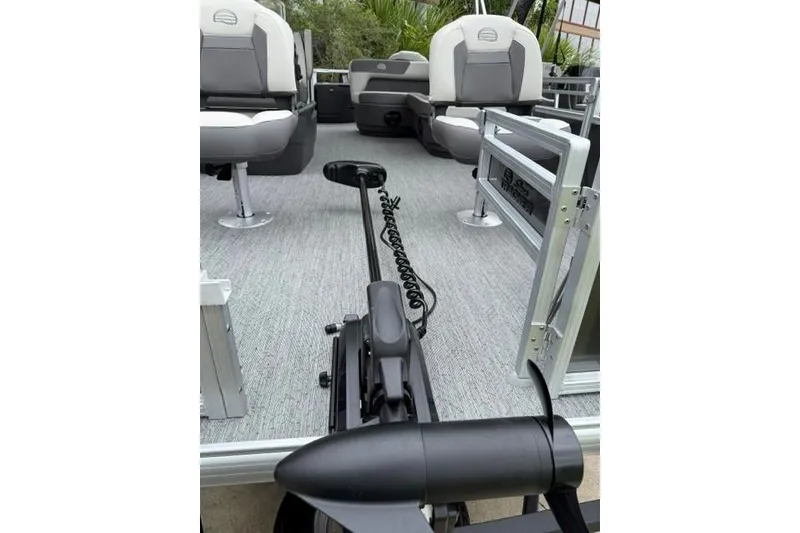 Slide: The Image of 2026 Sun Tracker Bass Buggy 18 DLX interior with seating and trolling motor. - 4