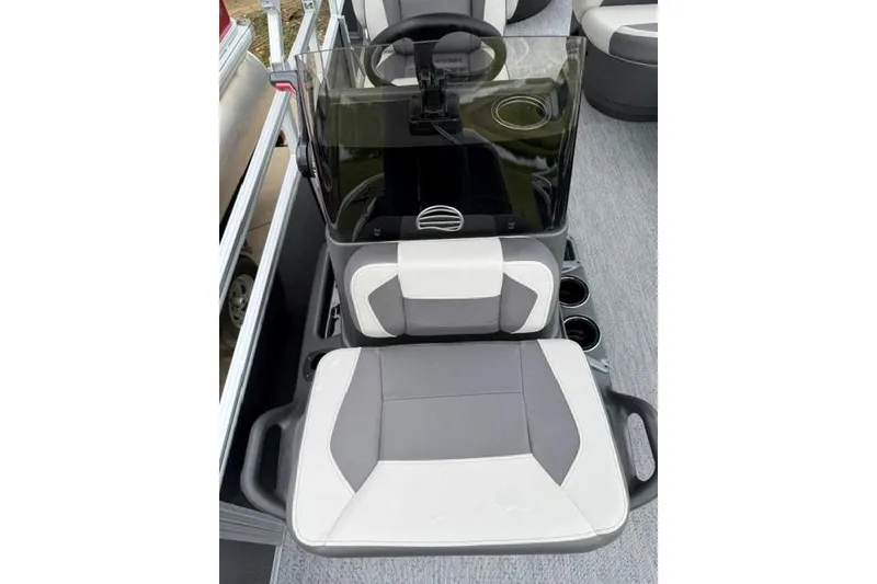 Slide: The Image of 2026 Sun Tracker Bass Buggy 18 DLX boat interior with steering console and seating. - 6