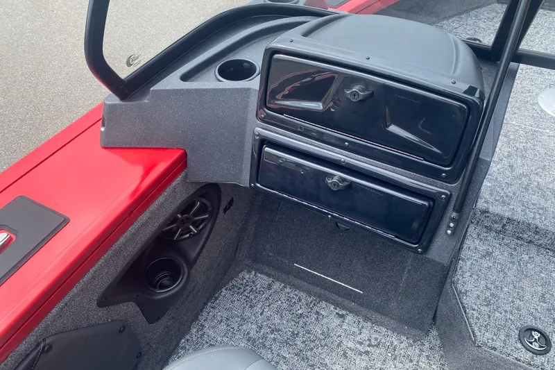Slide: The Image of 2026 Tracker Targa V-19 Combo boat interior with storage compartments and speaker system. - 6