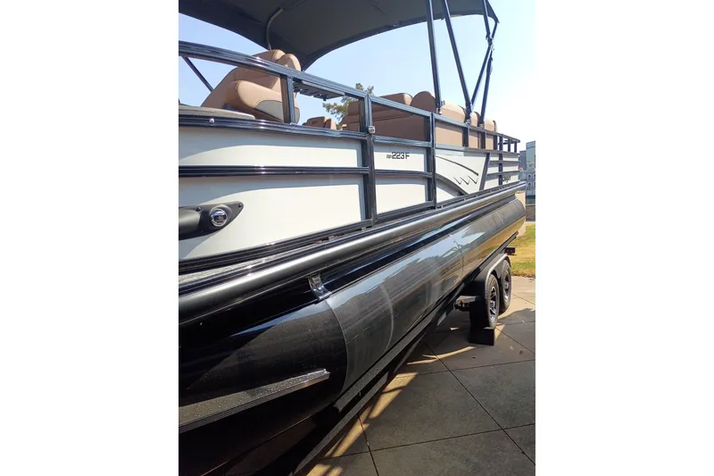 Slide: The Image of 2026 Ranger 223F pontoon boat with sleek design and comfortable seating. - 3