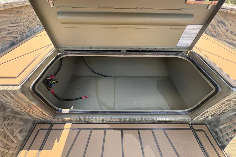Slide: The Image of Open storage compartment of 2026 Tracker Grizzly 1650 T Prairie Wings Edition boat. - 43
