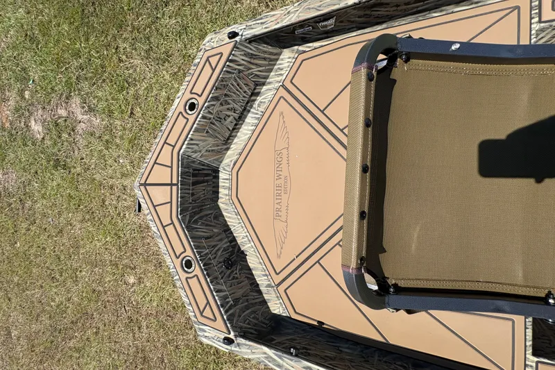 Slide: The Image of 2026 Tracker Grizzly 1650 T Prairie Wings Edition boat deck with camouflage design. - 42