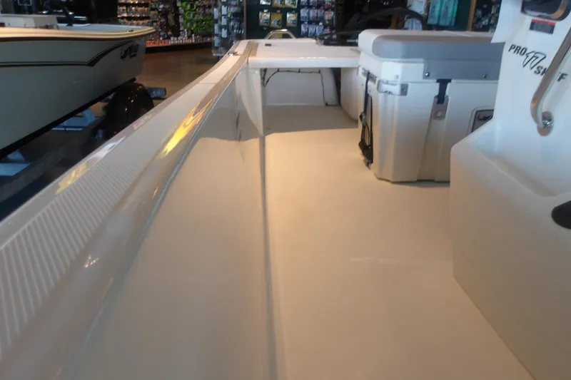 Slide: The Image of 2026 Mako Pro Skiff 17 CC interior view, showcasing spacious deck and seating area. - 15