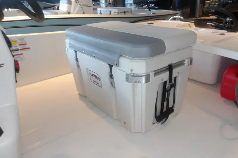 Slide: The Image of 2026 Mako Pro Skiff 17 CC boat interior with cushioned cooler seat. - 6