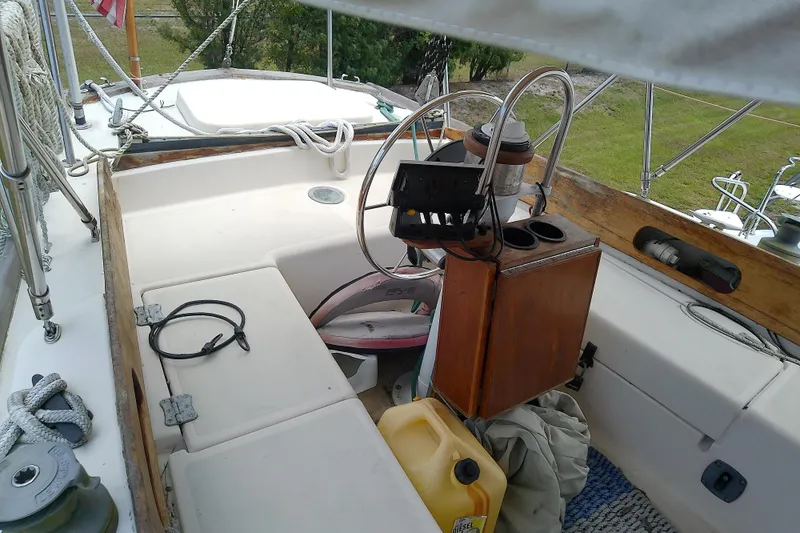 Slide: The Image of Cockpit of 1981 Sea Sprite 34 sailboat with steering wheel and nautical equipment. - 13