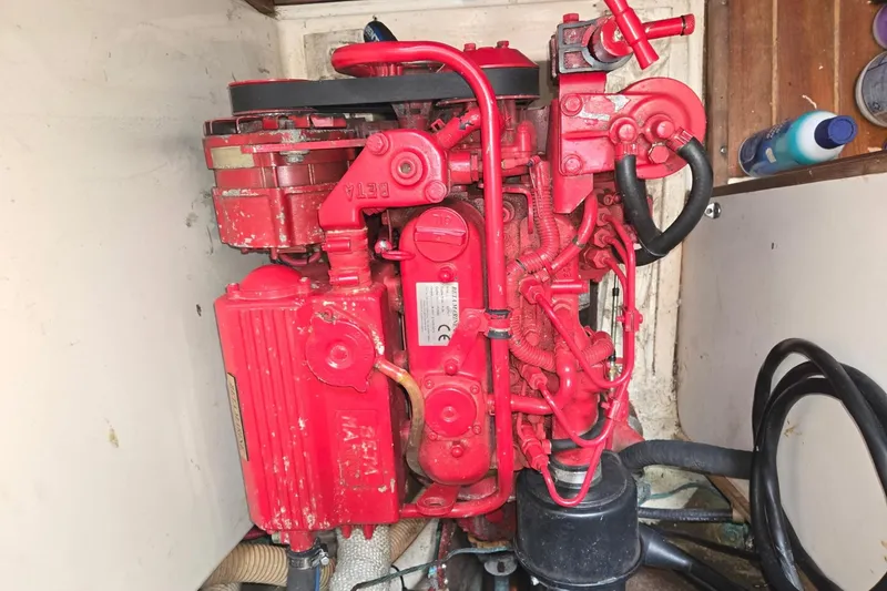 Slide: The Image of Red engine inside a 1981 Sea Sprite 34 sailboat, showcasing mechanical components. - 17