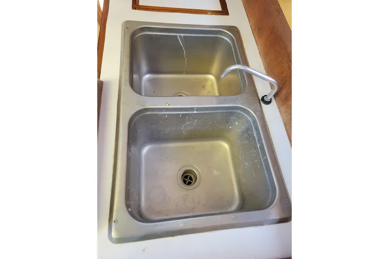 Slide: The Image of Stainless steel double sink in 1981 Sea Sprite 34 boat galley. - 25
