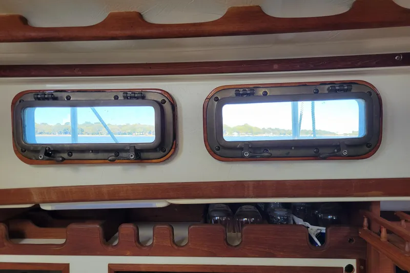 Slide: The Image of Interior view of 1981 Sea Sprite 34 sailboat with wooden trim and portholes. - 27