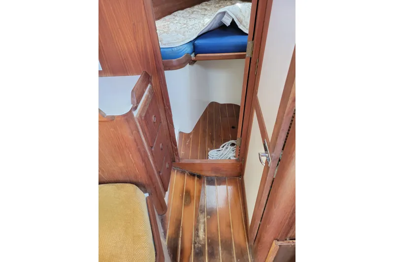Slide: The Image of Interior of 1981 Sea Sprite 34 sailboat with wooden flooring and cozy cabin space. - 29