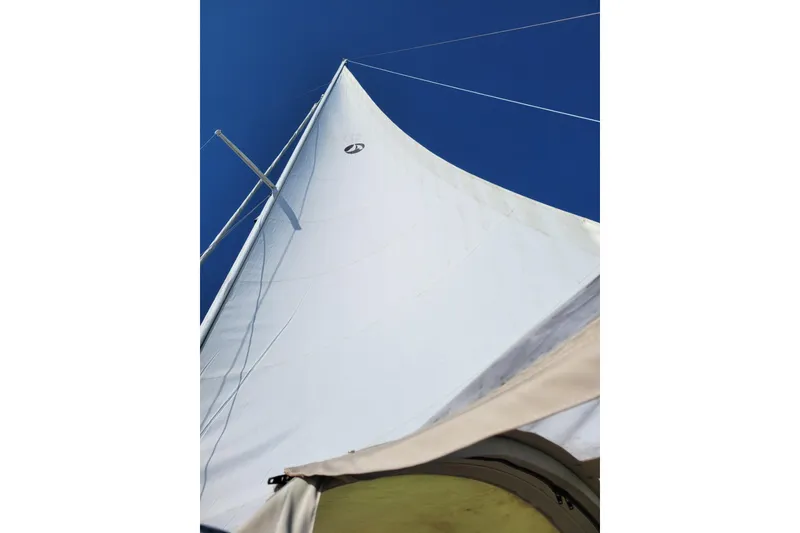 Slide: The Image of Sail of 1981 Sea Sprite 34 yacht against clear blue sky. - 34