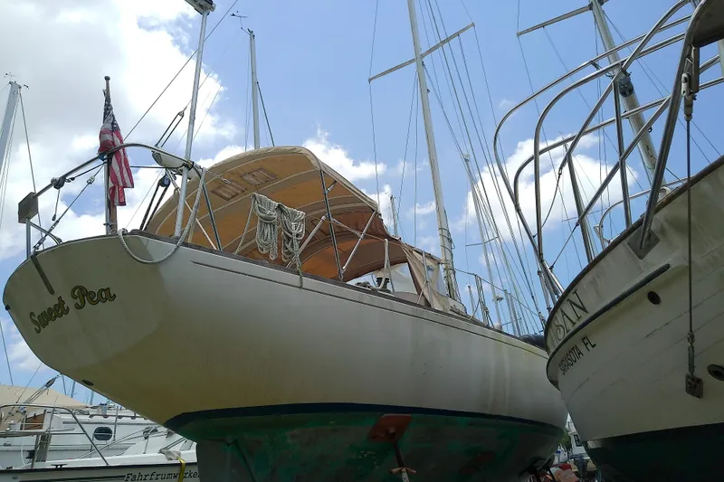 Slide: The Image of 1981 Sea Sprite 34 sailboat "Sweet Pea" docked, with clear blue sky background. - 6