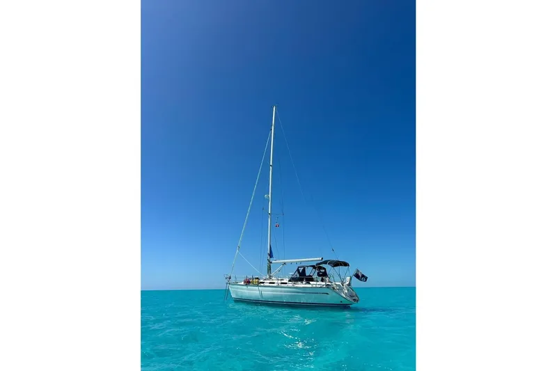 The Image of Sailing yacht Bavaria 42 (2001) on clear turquoise water under a bright blue sky. - 1
