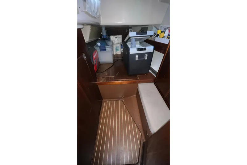 Slide: The Image of Interior of a 2001 Bavaria 42 yacht with storage and equipment. - 7