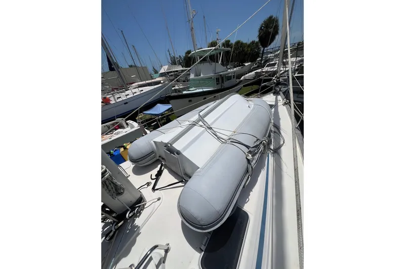 Slide: The Image of Sailboat deck with inflatable dinghy, Bavaria 42, 2001 model, docked at marina. - 18