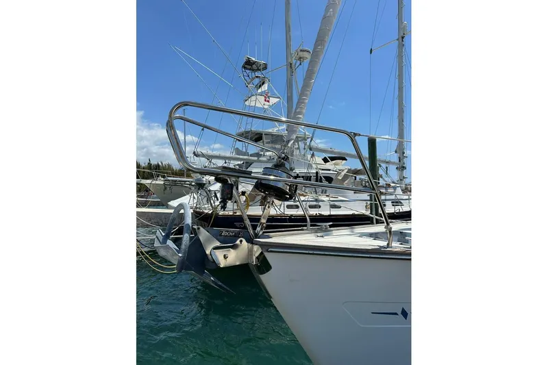 Slide: The Image of Sailboat Bavaria 42 (2001) docked, featuring anchor and bow details. - 4