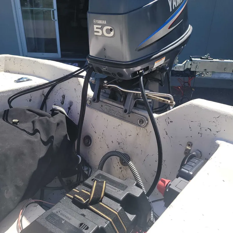 Slide: The Image of A Yamaha 50 horsepower outboard motor is mounted on a boat. - 8