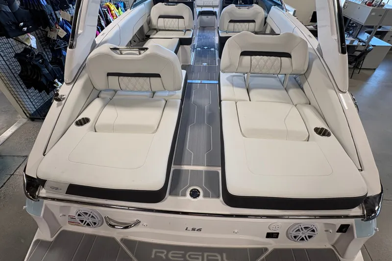 Slide: The Image of 2027 Regal LS6 boat interior with white seating and modern design. - 5