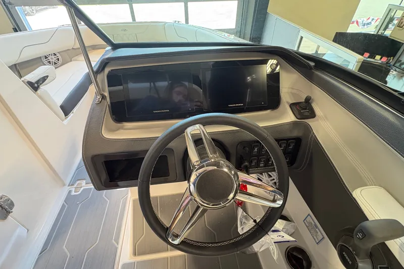 Slide: The Image of 2027 Regal LS6 boat dashboard with steering wheel and digital display. - 11