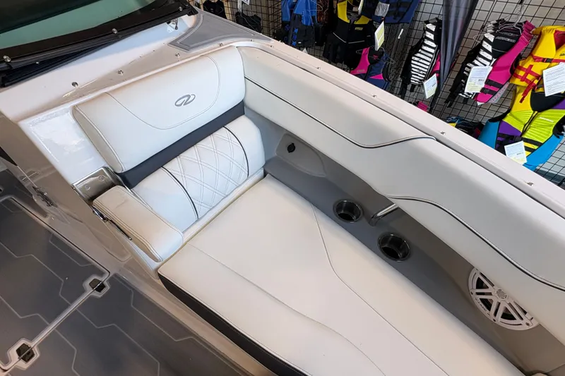Slide: The Image of Luxurious seating in 2027 Regal LS6 boat with white upholstery and cup holders. - 7