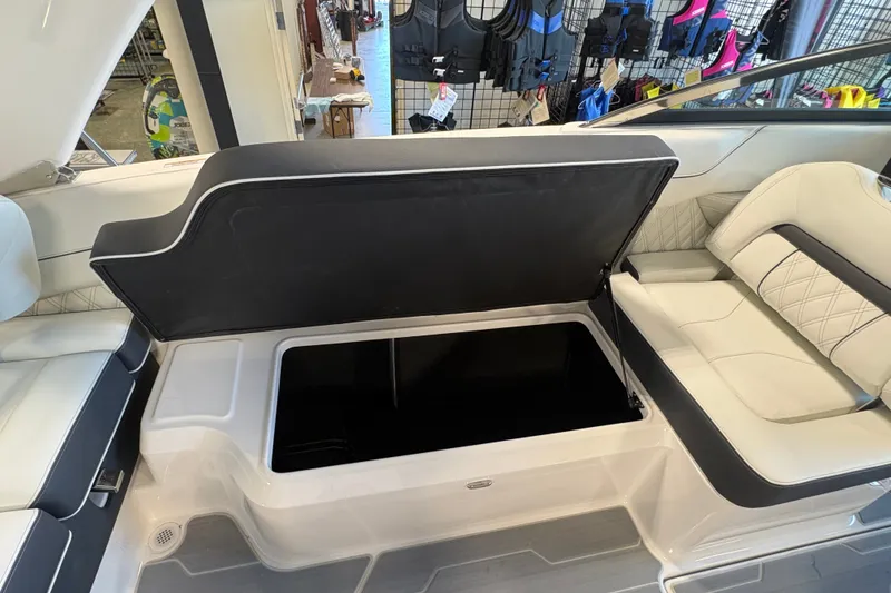 Slide: The Image of 2027 Regal LS6 boat interior with open storage compartment and luxurious seating. - 19