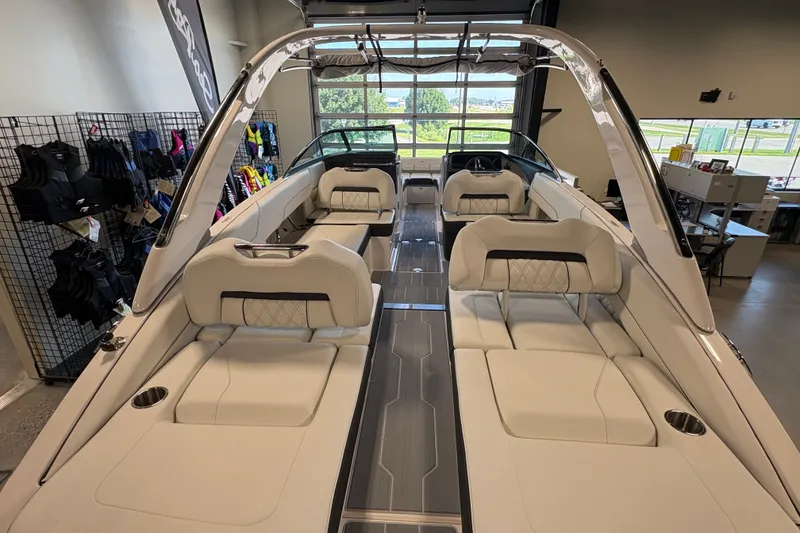 Slide: The Image of 2027 Regal LS6 boat interior with luxurious seating and modern design in showroom. - 4