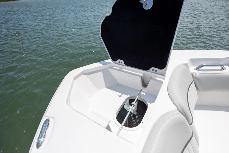 Slide: The Image of 2022 Sea Fox 228 Commander anchor storage compartment open on calm water. - 11