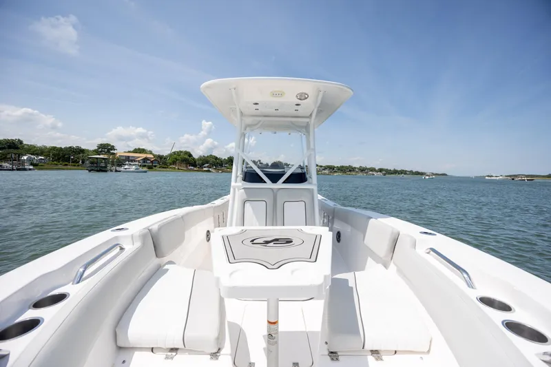Slide: The Image of 2022 Sea Fox 228 Commander boat on calm water, featuring spacious seating and sleek design. - 12