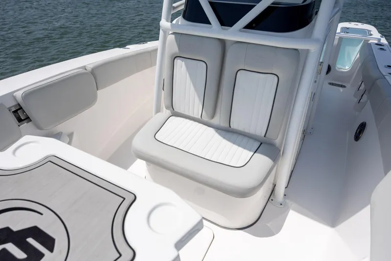 Slide: The Image of 2022 Sea Fox 228 Commander boat interior with cushioned seating and table. - 13