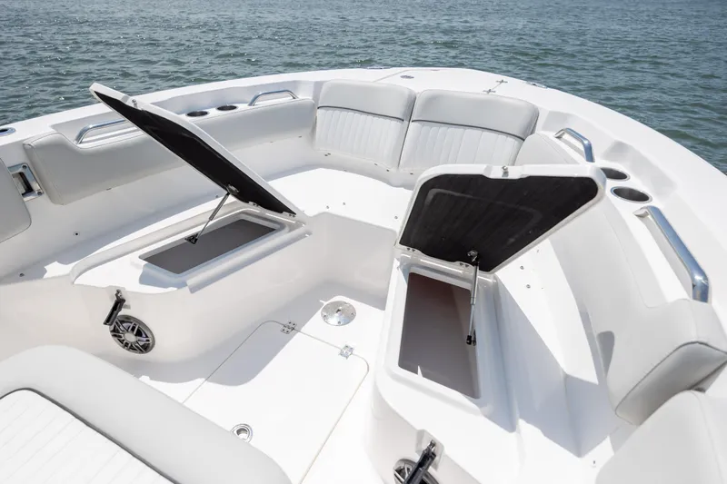 Slide: The Image of 2022 Sea Fox 228 Commander boat interior with open storage compartments and cushioned seating. - 14