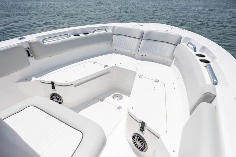 Slide: The Image of 2022 Sea Fox 228 Commander boat interior with cushioned seating and storage compartments. - 17