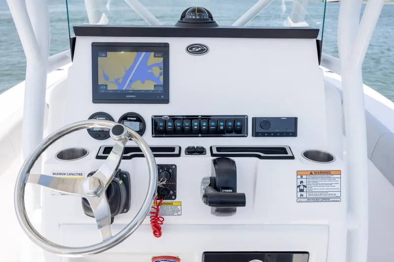 Slide: The Image of 2022 Sea Fox 228 Commander boat dashboard with steering wheel and navigation system. - 19