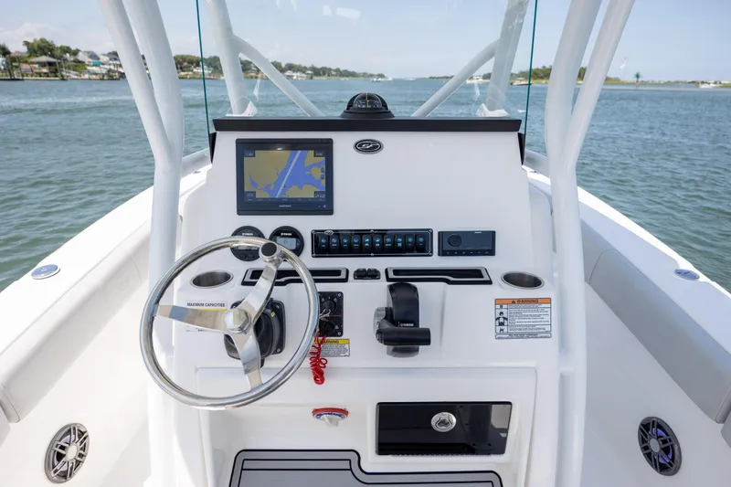 Slide: The Image of 2022 Sea Fox 228 Commander boat dashboard with steering wheel and navigation display. - 20