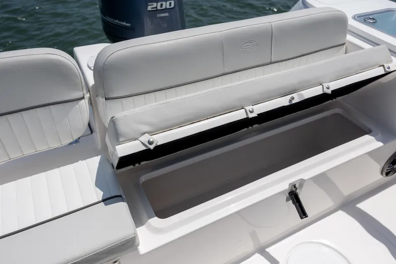 Slide: The Image of 2022 Sea Fox 228 Commander boat seat with storage compartment open. - 23