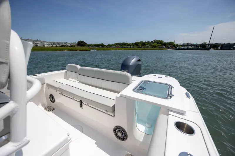 Slide: The Image of 2022 Sea Fox 228 Commander boat interior with seating and water view. - 24