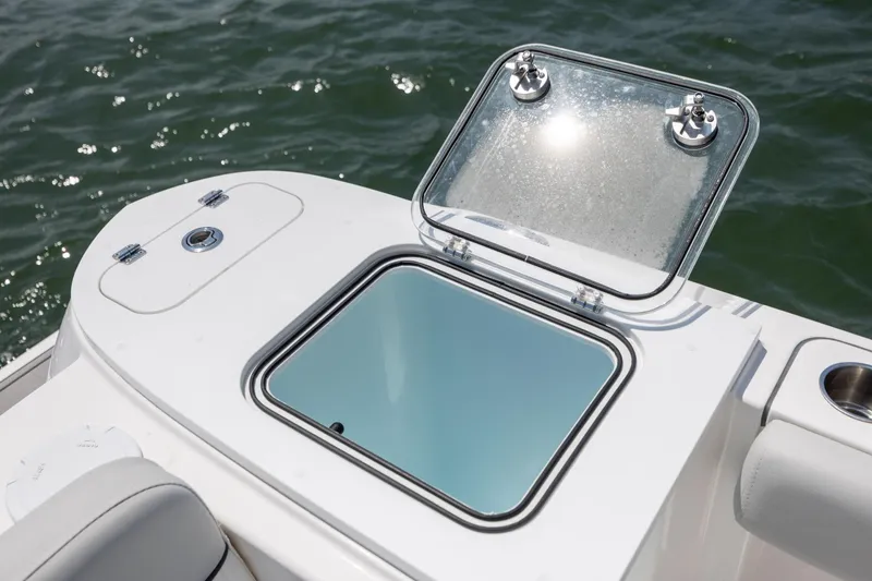 Slide: The Image of 2022 Sea Fox 228 Commander boat with open storage compartment on deck. - 25