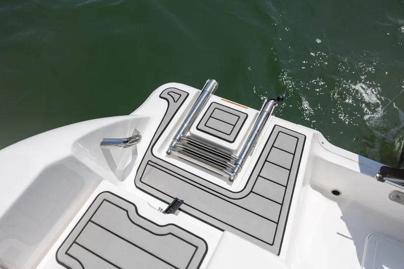 Slide: The Image of 2022 Sea Fox 228 Commander swim platform with ladder on water. - 27